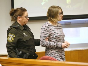 In this Nov. 11, 2016 file photo, Morgan E. Geyser is escorted into a Waukesha County Court in Waukesha, Wis. Geyser, one of two Wisconsin girls charged with stabbing a classmate to impress the fictitious horror character Slender Man will plead guilty in a deal that calls for her to avoid prison time, attorneys announced Friday, Sept. 29, 2017. Geyser will remain in a state mental hospital under an agreement announced in a court hearing two weeks before her trial was set to start. (Michael Sears/Milwaukee Journal-Sentinel via AP, Pool,File)