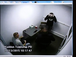 David Creato Jr., top right, is informed that his son has been found dead by detectives Don Quinn, left, and Michael Rhoads, centre, while being questioned in this video from October 2015. (David Swanson/The Philadelphia Inquirer via AP)