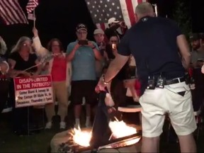 In this screenshot, New England Patriots fans burn team memorabilia at a jersey burning party in response to NFL anthem protests. (Twitter)