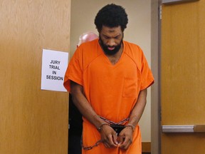 Alton Nolen, who is charged with first-degree murder in the September 2014 beheading of 54-year-old Colleen Hufford at Vaughan Foods in Moore, Okla., is led from the courtroom on Sept. 11, 2017, following a morning of jury selection in his trial in Norman, Okla. (Sue Ogrocki/AP Photo)