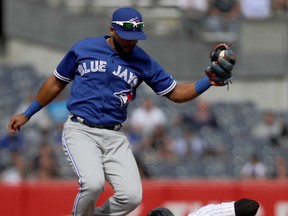 Richard Urena of the Toronto Blue Jays fails to tag out Aaron Hicks of the New York Yankees at second in the fifth inning at Yankee Stadium on Sept. 29, 2017. (Abbie Parr/Getty Images)