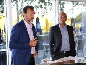 Jean Deschenes, left, and Brad McDonald of M + H property management talk about the Rideau Town Centre at the East Kingston Business Association Breakfast at the Glen Lawrence Golf Club in Kingston on Friday Sept. 29 2017. Ian MacAlpine /The Whig-Standard/Postmedia Network