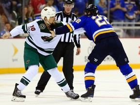 Minnesota Wild right wing Chris Stewart and St. Louis Blues right wing Chris Thorburn square off during the first period of an NHL pre-season game in Kansas City, Mo., on Sept. 28, 2017. (AP Photo/Orlin Wagner)
