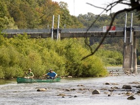 John Hlodan, and his son Ryan, set off for a trip down the Thames River in their 17-foot Nova Craft canoe from just below the broken Springbank Dam on Monday, September 11, 2017. (MIKE HENSEN, The London Free Press)