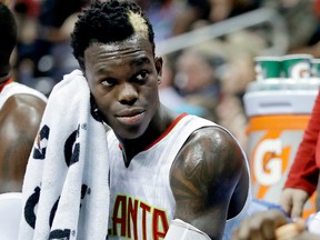 In this March 8, 2017, Atlanta Hawks' Dennis Schroder, of Germany, sits on the bench during the second quarter of an NBA basketball game against the Brooklyn Nets in Atlanta. (AP Photo/David Goldman, File)
