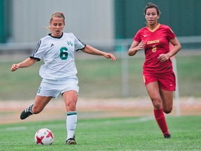 University of Alberta Pandas defender Jamie Pasemko plays the ball in front of University of Calgary Dinos midfielder Sienna Prince-McPherson in Canada West play on Sept. 9, 2017 at Foote Field in Edmonton.