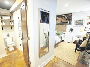 Designers Sarah Roussos-Karakaian and Nick Karakaian strategically placed this mirror in their basement Airbnb to not only provide an opportunity for guests to check their appearance before heading out for the day but also to reflect light from the only window in the space. (Kris Rogers Photography)