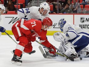Detroit Red Wings centre Dylan Larkin tries hitting the puck past Toronto Maple Leafs goalie Frederik Andersen of Denmark during NHL pre-season action on Sept. 29, 2017. (AP Photo/Carlos Osorio)