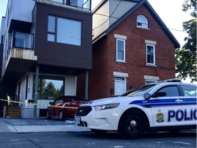 Police on the scene of an early morning shooting in Old Ottawa East Saturday, Sept. 30. One man was wounded in the thigh.(Ashley Fraser, Postmedia)