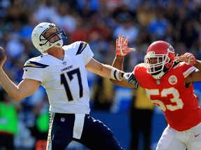 Philip Rivers #17 of the Los Angeles Chargers passes the ball under pressure by Ramik Wilson #53 of the Kansas City Chiefs during the second half of a game at StubHub Center on September 24, 2017 in Carson, California. (Photo by Sean M. Haffey/Getty Images)