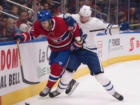 Montreal Canadiens' Jonathan Drouin, left, and Toronto Maple Leafs' Miro Aaltonen battle for the puck along the boards during first period NHL pre-season action Wednesday, September 27, 2017 in Quebec City. Drouin is among the players expected to have a breakthrough NHL season this year. (THE CANADIAN PRESS/Jacques Boissinot)