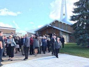Mourners leave the service held for Sheila Welsh at St. Francis Xavier church in Renfrew on Saturday.
