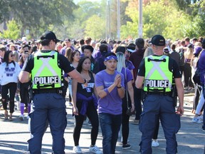 Around 11,000 people packed Broughdale Avenue and nearby streets for an unsanctioned Western University Homecoming party Saturday. DALE CARRUTHERS / THE LONDON FREE PRESS