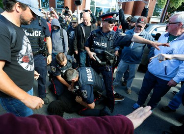 Tensions rise as city police deal with a protestor during a White Supremacy demonstration on Saturday September 30, 2017 on George St. in Peterborough, Ont. CLIFFORD SKARSTEDT/PETERBOROUGH EXAMINER/POSTMEDIA NETWORK