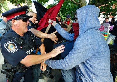 Tensions rise as protestors clash with city police during a White Supremacy demonstration on Saturday September 30, 2017 on George St. in Peterborough, Ont. CLIFFORD SKARSTEDT/PETERBOROUGH EXAMINER/POSTMEDIA NETWORK