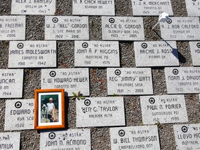 A single framed photograph rests atop an Ad Astra stone alongside a path at the Royal Canadian Air Force Memorial Airpark on Saturday September 30, 2017 in Quinte West, Ont. In the past year, 226 new stones have been added. Tim Miller/Belleville Intelligencer/Postmedia Network