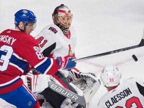 Canadiens’ Ales Hemsky (left) moves in on Senators goaltender Craig Anderson as Fredrik Claesson defends in Montreal last night. (The Canadian Press)