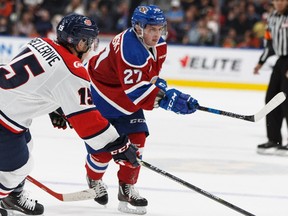 Edmonton's Trey Fix-Wolansky shoots past Lethbridge's Jordy Bellerive during the third period of a game between the Edmonton Oil Kings and the Lethbridge Hurricanes at Rogers Place in Edmonton, Alberta on Friday, September 29, 2017.