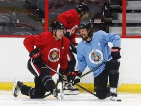 Senators’ Dion Phaneuf and Erik Karlsson share a laugh recently. Getting Karlsson back would be huge for the Senators. (Tony Caldwell/Ottawa Sun)