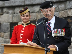 Honorary Colonel Britton Smith of Kingston speaks at the Wall of Honour ceremony at the Royal Military College of Canada on Saturday. (Steph Crosier/The Whig-Standard)