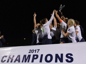 FC London women?s team players celebrate with the trophy after clinching first place in League1 Ontario on Saturday in Mississauga, the team?s second straight championship. (League1 Ontario/Martin Bazyl Photography)