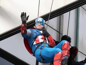 Captain America rappels down the side of Health Sciences North during last year's Superheroes for Little Heroes event. (Sudbury Star file photo)