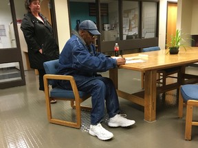 This image released by the Nevada Department of Corrections shows O.J. Simpson signing documents and leaving Lovelock Correctional Centre in Lovelock, Nevada, early on October 1, 2017. (AFP PHOTO / Nevada Department of Corrections)
