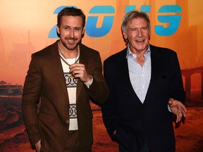 Harrison Ford (R) and Ryan Gosling (L) pose during a photocall for the film 'Blade Runner 2049' in Paris on September 20, 2017. / AFP PHOTO / Philippe LOPEZ (Photo credit should read PHILIPPE LOPEZ/AFP/Getty Images)
