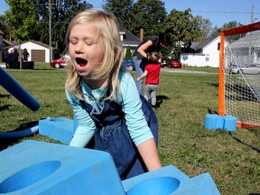 Emily Guyitt, 5, plays with giant blocks during the Chatham Central Neighbourhood Association's family fun day on Saturday.