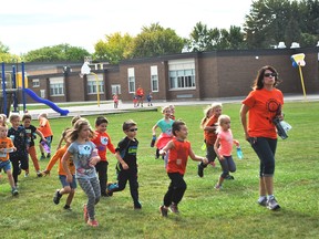 Grade 1 students from Indian Creek Road Public School take part in their Terry Fox Run with teacher Sarri Stonefish.