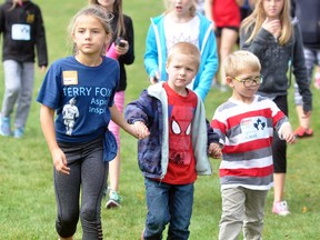 The annual Terry Fox run was held at Upper Thames Elementary School (UTES) last Thursday, Sept. 28, with students out enjoying the cool, crisp autumn weather walking or running for cancer research. Rachel Haefling (left), wearing a Terry Fox t-shirt, walks the course with primary students Kingston Campbell and Garret Carpenter. ANDY BADER/MITCHELL ADVOCATE