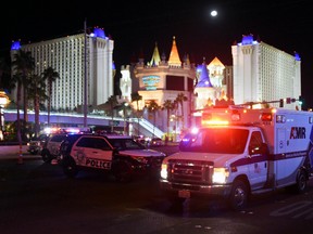 An ambulance leaves the intersection of Las Vegas Boulevard and Tropicana Ave. after a mass shooting at a country music festival nearby on October 2, 2017 in Las Vegas, Nevada. (Photo by Ethan Miller/Getty Images)