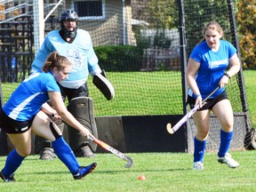 Sam Becker (left), goalie Emma Francis and Gabby Phillips defend their goal during H-P field hockey action Sept. 25. SUBMITTED