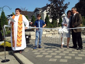 Trinity United minister Cheryl Kirk, Thomas Martin, Jean Bolt and Jack Wilford get ready to cut the ribbon at Trinity United's dedication of their new peace garden on Sunday, September 17.
