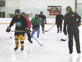 Kristin Raychert, right, leads the Vulcan Hawks midget hockey players in one of several power skating sessions Monday evening, Sept. 25, at the Vulcan District Arena.