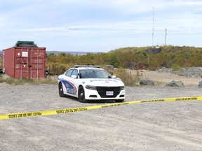 A Greater Sudbury Police Service officer guards the scene on Fieldstone Drive where human remains were found in Sudbury, Ont. on Monday October 2, 2017.  It has been confirmed that the found remains are a human lower jaw bone.Gino Donato/Sudbury Star/Postmedia Network