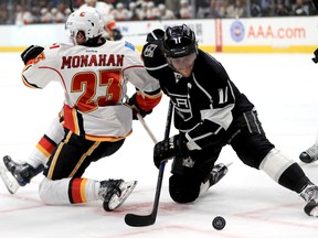 Sean Monahan of the Calgary Flames battles Anze Kopitar of the Los Angeles Kings for a loose puck during the first period of a game at Staples Center on April 6, 2017. (Sean M. Haffey/Getty Images)