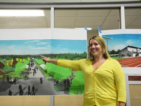 Chelsea Grande, director of community services, presents concept art of the potential changes to Rotary Park during an open house at the Carlan Community Resource Centre on June 28 (Peter Shokeir | Whitecourt Star).