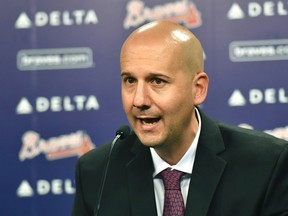 In this Oct. 1, 2015, file photo, Atlanta Braves general manager John Coppolella speaks during a baseball news conference at Turner Field in Atlanta. Coppolella has resigned from his position, the Braves announced on Oct. 2, 2017 (Hyosub Shin/Atlanta Journal-Constitution via AP, File)