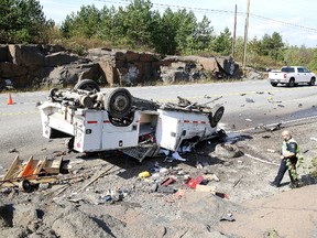 Greater Sudbury Police, along with paramedics and firefighters, responded to a single-vehicle rollover on Municipal Road 80, just past Tracks & Wheels Equipment Brokers in Sudbury on Monday. The driver was transported to hospital after striking the rock cut and rolling over. (Gino Donato/Sudbury Star)