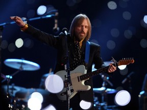 This file photo taken on February 2, 2008 shows musician Tom Petty performing during halftime at Super Bowl XLII at the University of Phoenix Stadium in Glendale, Arizona.
Tom Petty, the Southern-accented rocker whose classic melodies and dark storytelling created 40 years of hit songs, died on October 2, 2017 of cardiac arrest, his family said. He was 66. Petty, who sold 80 million records, passed away Monday evening surrounded by loved ones after a confusing day in which several media outlets reported and then retracted premature news of his death. / AFP PHOTO / Timothy A. CLARYTIMOTHY A. CLARY/AFP/Getty Images