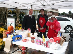 Lieutenant David Hickman (left) of the Salvation Army, along with volunteers Rob McFarlane and Denyse Allin, were set up outside Foodland in Clinton last Friday, where the organization was collecting non-perishable food items for its Thanksgiving food drive. A BBQ hot dog lunch and refreshments were also available for a small donation.