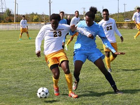 Richard John, left, of Cambrian College, battles for the ball with Malcolm Whyte, of Sheridan College, during soccer action at Cambrian College in Sudbury, Ont. in this Saturday, September 9, 2017 file photo. John Lappa/Sudbury Star/Postmedia Network