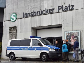 A police car blocks the entrance of the city train station Inssbrucker Platz in Berlin, Germany, on Monday, Oct. 2, 2017. Some 10,000 people were evacuated from their homes in western Berlin, trains were stopped and a main highway was blocked so specialists could remove a Second World War-era bomb discovered during construction work. (Bernd Settnik/dpa via AP)