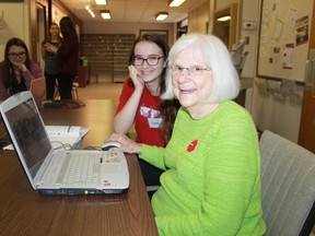 Northern Collegiate's Hannah Cattran and Fairwinds Lodge Home's Kathleen Jacques watch a YouTube video together during the Cyber Seniors program in November 2016.
CARL HNATYSHYN/SARNIA THIS WEEK