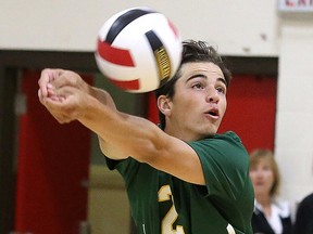 Julian Simeoni of the Lockerby Vikings bumps the ball during senior boys high school volleyball action against the St. Charles Cardinals in Sudbury, Ont. on Monday October 2, 2017. Gino Donato/Sudbury Star/Postmedia Network