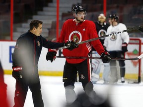 Ottawa Senators coach Guy Boucher talks to Logan Brown during practice in Ottawa on Oct. 2, 2017. (Tony Caldwell/Postmedia)