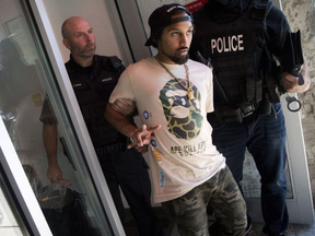 Ottawa Police raided Cannabis Culture on Bank Street Tuesday Oct. 3 and took five men into custody. It's the second time the illegal marijuana dispensary has been raided. ASHLEY FRASER / POSTMEDIA