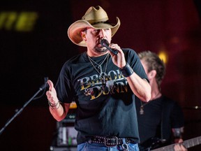 In this June 7, 2017 file photo Jason Aldean performs during a surprise pop up concert at the Music City Center in Nashville, Tenn. Aldean was the headlining performer when a gunman opened fire at a music festival on the Las Vegas Strip on Sunday, Oct. 1. (Photo by Amy Harris/Invision/AP, File)