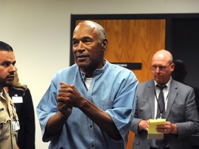 O.J. Simpson (C) reacts after learning he was granted parole at Lovelock Correctional Center July 20, 2017 in Lovelock, Nevada. Simpson is serving a nine to 33 year prison term for a 2007 armed robbery and kidnapping conviction. (Photo by Jason Bean-Pool/Getty Images)